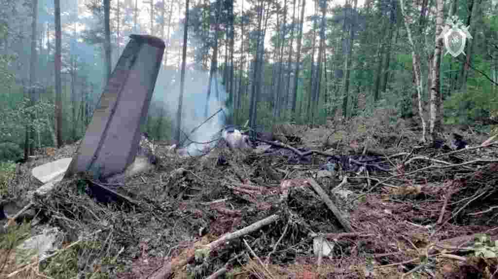 Wreckage of the Angara Airlines aircraft scattered across a forested hillside near Tynda, Russia